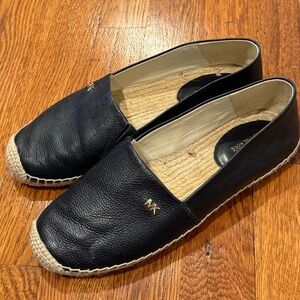 Navy leather MK flats.